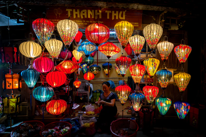 Colourful lanterns over a lively Hoi An street at night
